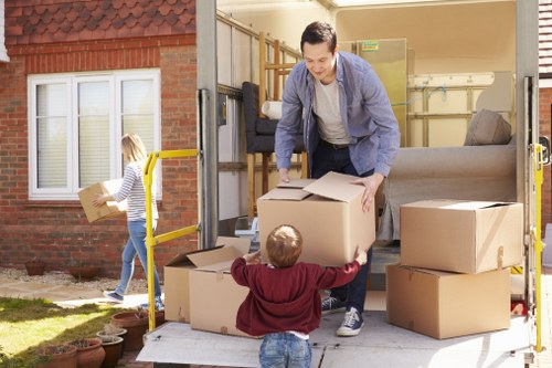 Professional movers handling furniture in Poplar